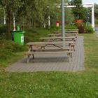 Picnic tables and bins present